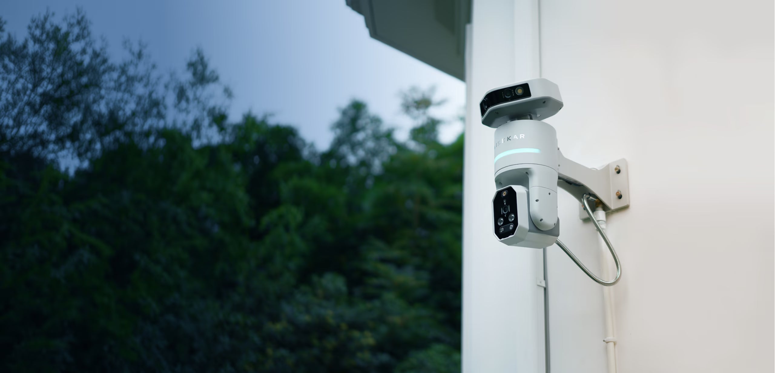Aisekar S1 mounted on an exterior wall, overlooking a garden