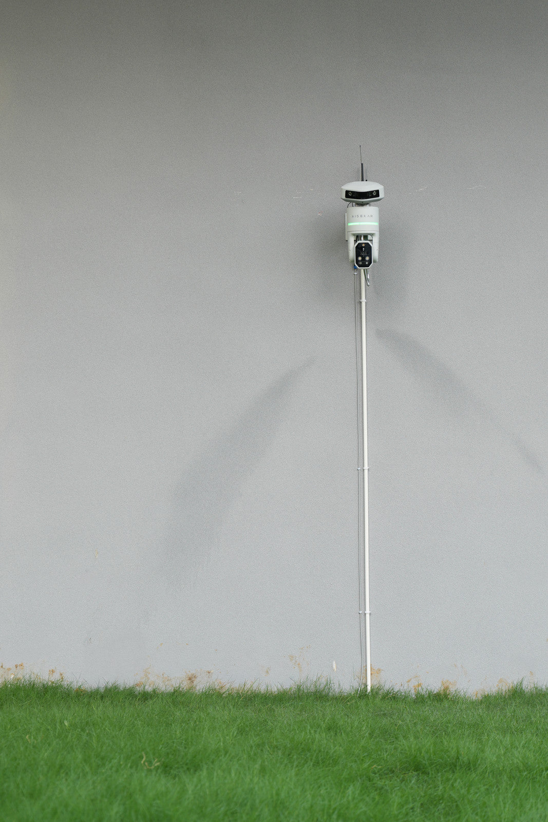 Aisekar installed outdoors beside a lawn